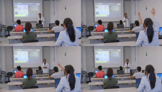 一群拉丁美洲学生在大学的机器人课上向老师提问高清在线视频素材下载