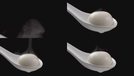 新鲜热腾腾的汤圆汤圆，白色的汤勺，黑色的背景。高清在线视频素材下载