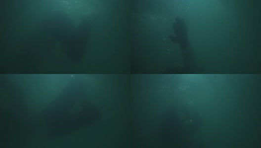 一个穿着衣服的人正在水里溺水高清在线视频素材下载