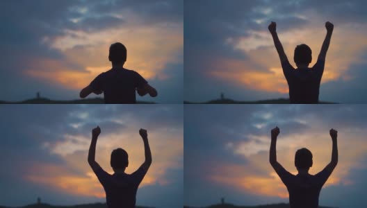 一个印度小孩的剪影，在美丽的日落前举起双臂。孩子举起手臂看日出。成功的背景。在他的生活中取得成功的孩子。高清在线视频素材下载
