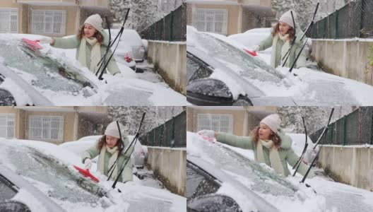 年轻女子正在清理车上的雪高清在线视频素材下载