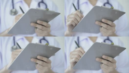 女医生在写字板上写报告高清在线视频素材下载