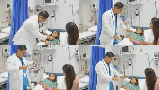 Pediatrician talking to patient and mother in recovery room高清在线视频素材下载