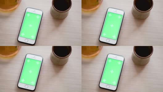 顶视图绿屏智能手机和咖啡滴高清在线视频素材下载