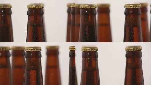 瓶啤酒与滴孤立在白色背景高清在线视频素材下载