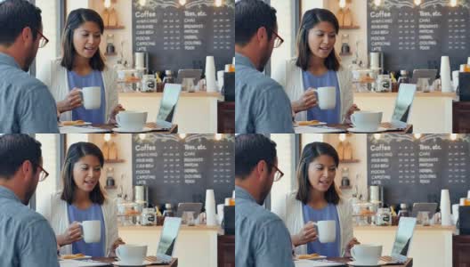 自信的中年亚洲销售员在当地的咖啡馆会见客户高清在线视频素材下载