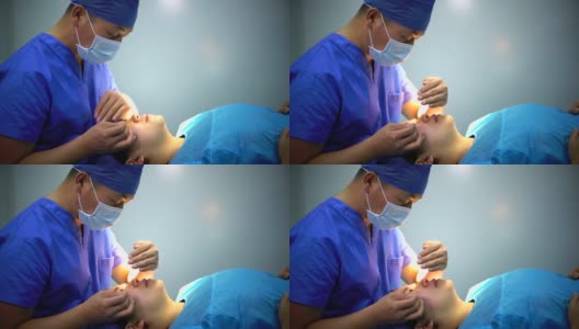 4K:医生在现代手术室为病人准备手术的肖像。高清在线视频素材下载