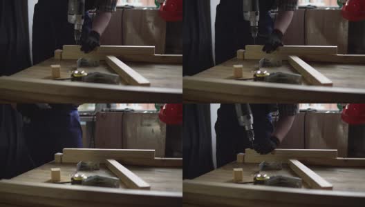 在建造木桌的过程中，木匠收集了底座。高清在线视频素材下载