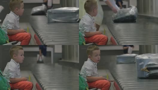 孩子在行李提取处等候高清在线视频素材下载