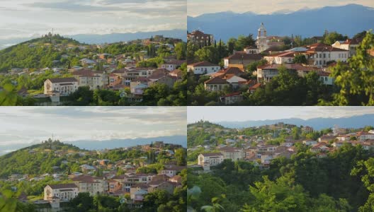 在雄伟的高加索山脉背景上的格鲁吉亚村庄鸟瞰图高清在线视频素材下载