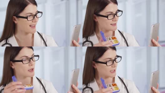 在病房里与病人通电话的专业女医生。在职女医生高清在线视频素材下载