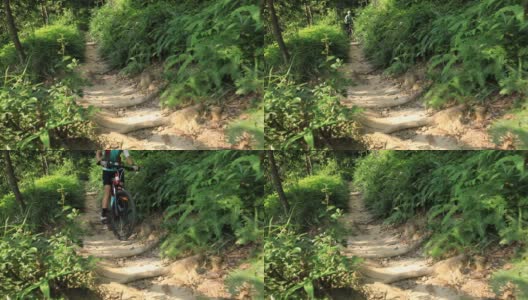 女自行车手越野自行车在热带雨林慢动作高清在线视频素材下载