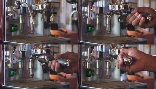 男咖啡师在咖啡馆用咖啡机煮咖啡高清在线视频素材下载