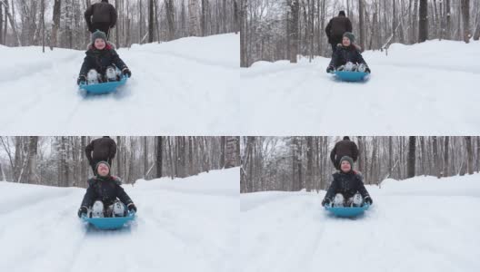 爷爷在冬天拉着孙子的雪橇高清在线视频素材下载