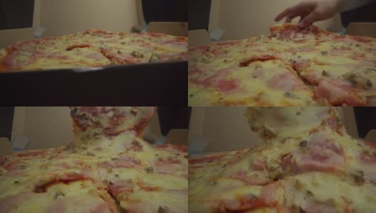 从披萨盒中挑选美味披萨的男人高清在线视频素材下载