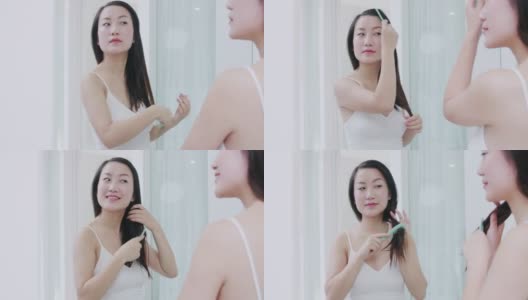 美丽的亚洲女人在家里洗澡后梳头高清在线视频素材下载