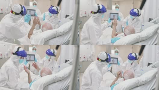 一名刚从Covid-19中康复的老人正在医院重症监护室与孙子视频通话高清在线视频素材下载
