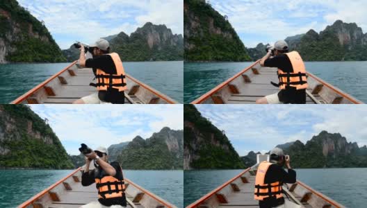 一个人坐在船上拍照高清在线视频素材下载