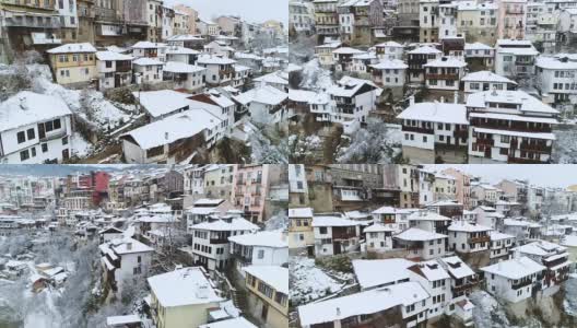 鸟瞰图的城市景观在冬天与白雪覆盖的屋顶和蜿蜒的河床高清在线视频素材下载