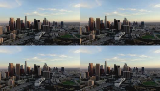 无人机拍摄的洛杉矶天际线下飞机和直升机高清在线视频素材下载
