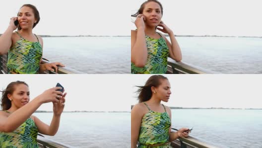 一个黑人女人在海湾边打电话高清在线视频素材下载