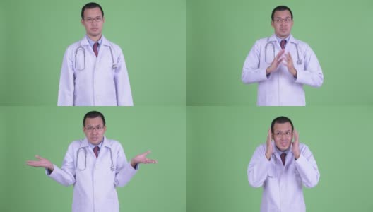 亚洲男医生的画室肖像在绿色背景下耸肩高清在线视频素材下载