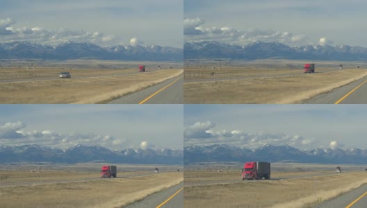 沿着高速公路向雄伟的积雪的落基山脉旅行高清在线视频素材下载