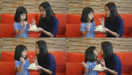 女孩和妈妈在咖啡店吃蛋糕高清在线视频素材下载