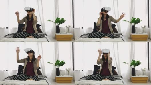 女人在卧室玩虚拟现实耳机，近距离高清在线视频素材下载