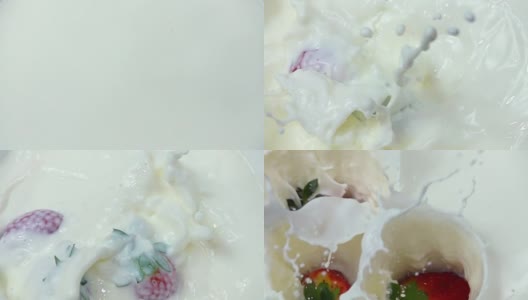 新鲜草莓落入奶油中的慢镜头高清在线视频素材下载
