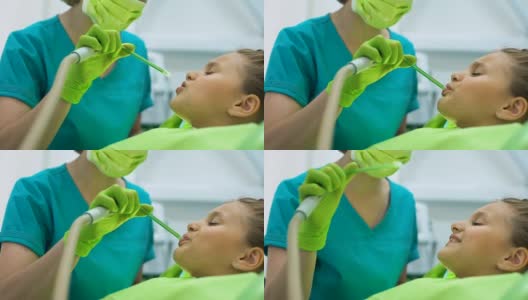 口腔医生用唾液喷射器，病人小儿微笑，顾客满意高清在线视频素材下载