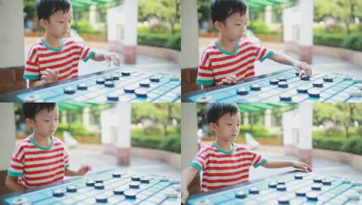 亚洲孩子在下中国象棋高清在线视频素材下载