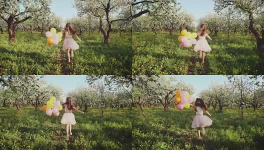 快乐的女孩与气球在盛开的花园中奔跑高清在线视频素材下载