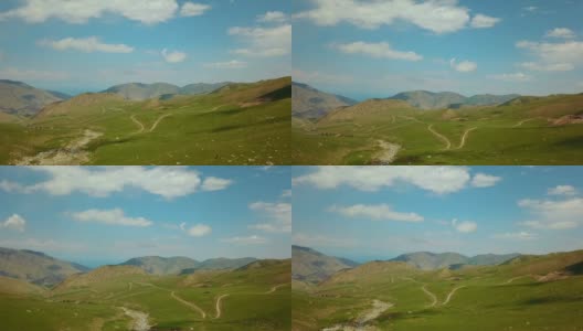 卡尔达莫通过Ak-kya - Kazarman下坡或平路。吉尔吉斯斯坦卡扎尔曼附近的山脉。吉尔吉斯斯坦的砾石曲线高清在线视频素材下载
