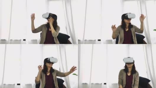 亚洲妇女在家里使用她的手机VR头盔。可负担得起的虚拟现实眼镜高清在线视频素材下载