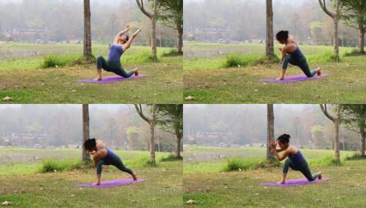 亚洲妇女练习瑜伽在旋转侧角姿势在户外公园。高清在线视频素材下载