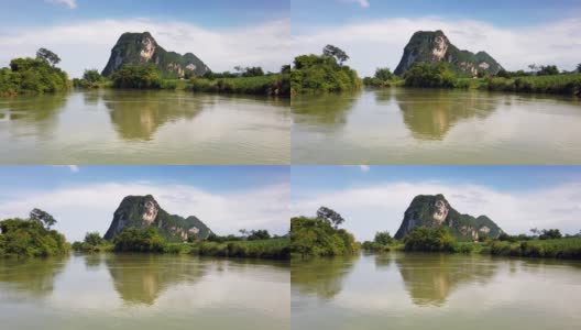 河上游弋着中国乡村的石灰岩景观和山水景观高清在线视频素材下载