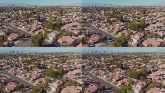 视频剪辑在拉斯维加斯，内华达州与春天山脉和拉斯维加斯天际线的背景在一个发展的小区的单一家庭住宅高清在线视频素材下载