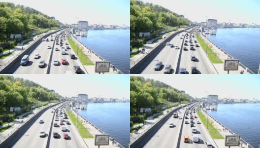 乌克兰基辅——2021年4月24日:汽车沿着基辅的路堤高速公路行驶。在一条繁忙的道路上，两个方向的车辆。俯视图高清在线视频素材下载