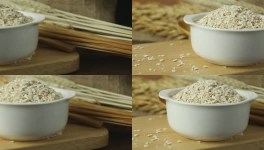 健康的早餐麦片燕麦片在碗上的木桌镜头。高清在线视频素材下载