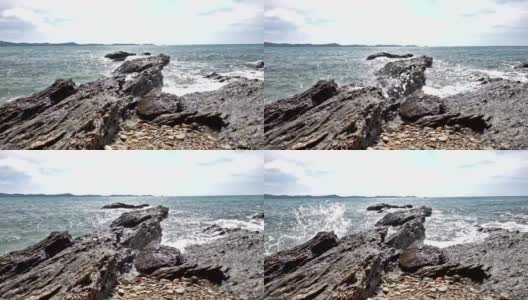 泰国热带海滩海浪击碎岩石海岸线的缓慢运动高清在线视频素材下载