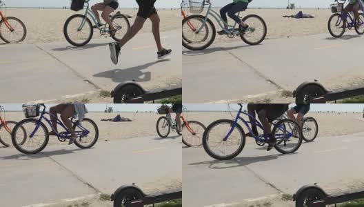 沙滩上的慢跑者和自行车爱好者高清在线视频素材下载