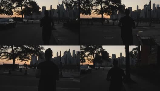 年轻人在纽约海滨的夕阳下工作高清在线视频素材下载