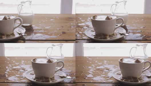 糖洒在木桌上的咖啡杯上高清在线视频素材下载