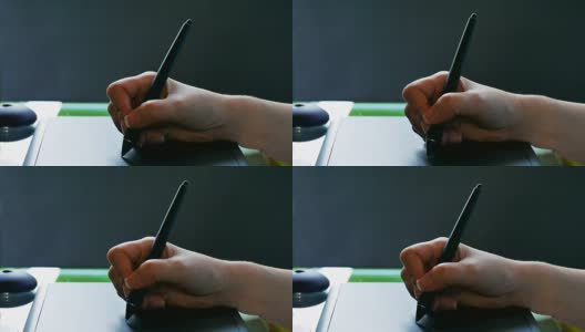 手写板和笔，黑色背景。高清在线视频素材下载