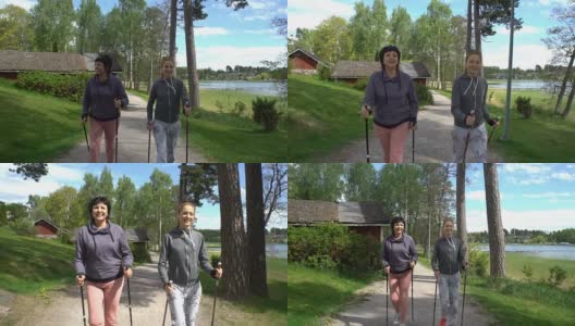 两个活跃的女人在公园里做北欧式散步。跟踪拍摄。慢动作高清在线视频素材下载