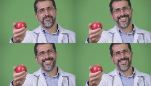 英俊的波斯胡子男子医生作为营养学家给苹果高清在线视频素材下载