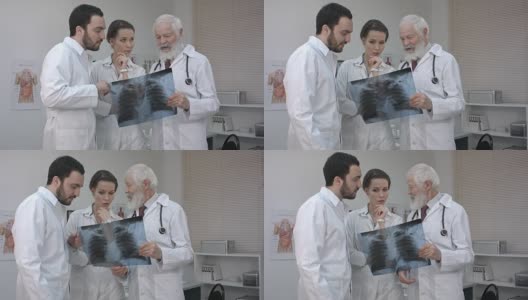 一群医生和护士在看x光片高清在线视频素材下载