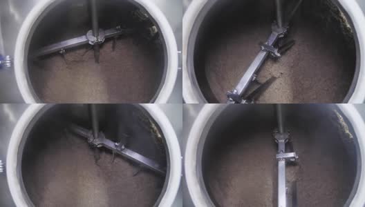 啤酒原料(大麦、小麦)在啤酒厂车间的大水槽中旋转高清在线视频素材下载