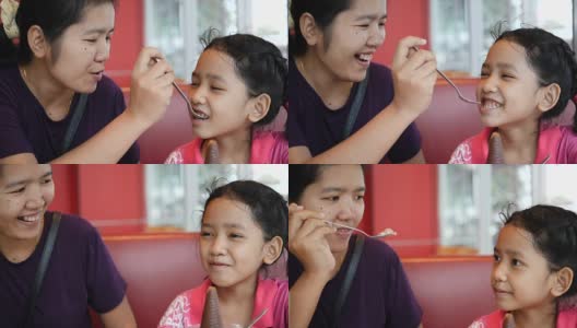 慢镜头亚洲母亲喂冰淇淋给女儿小女孩与幸福高清在线视频素材下载